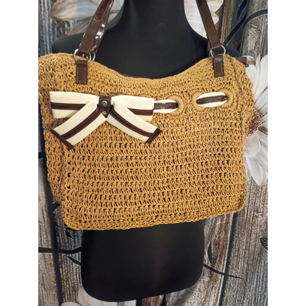 Braciano straw tote bag featuring a prominent white and brown striped bow detail